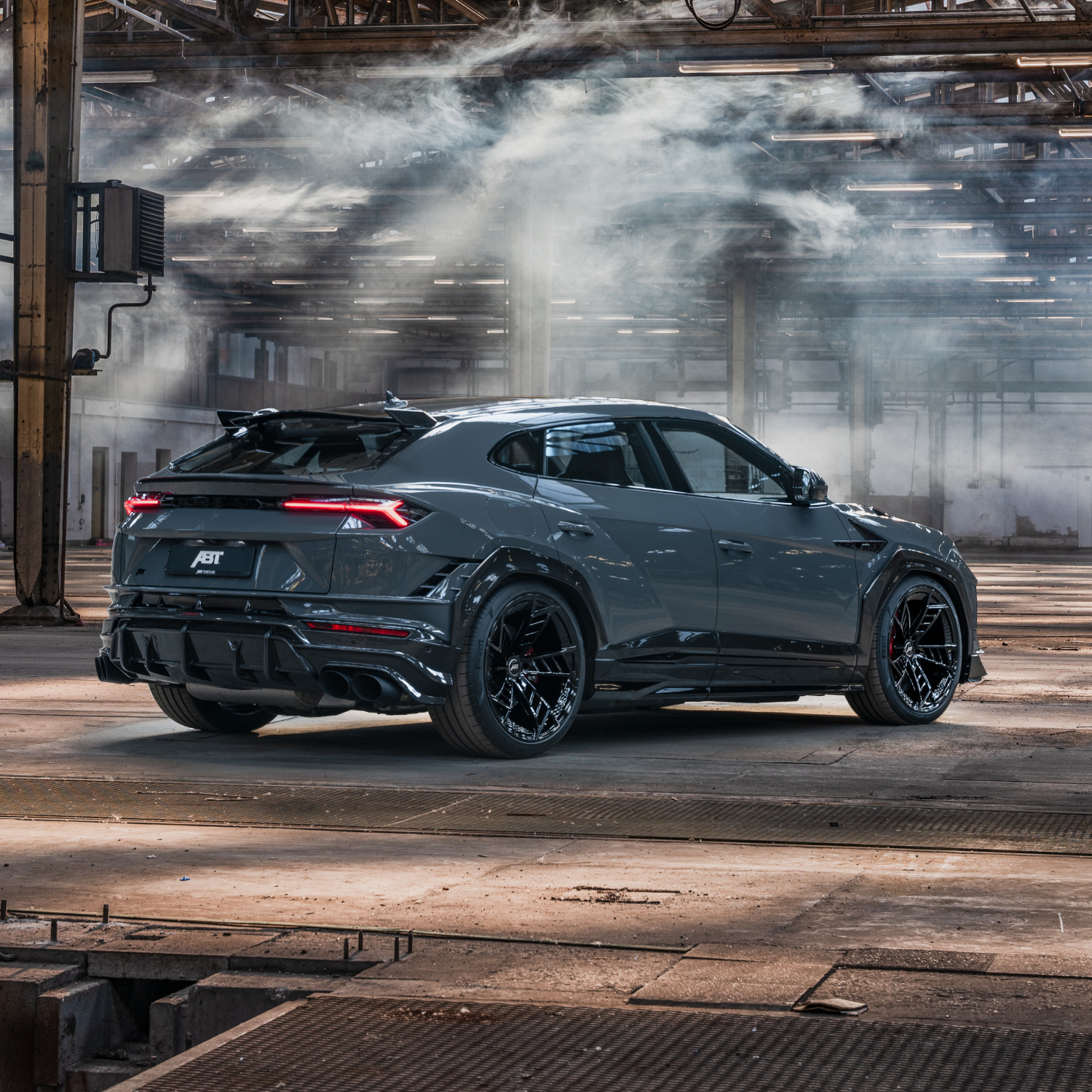 Blue Urus in warehouse from side rear view