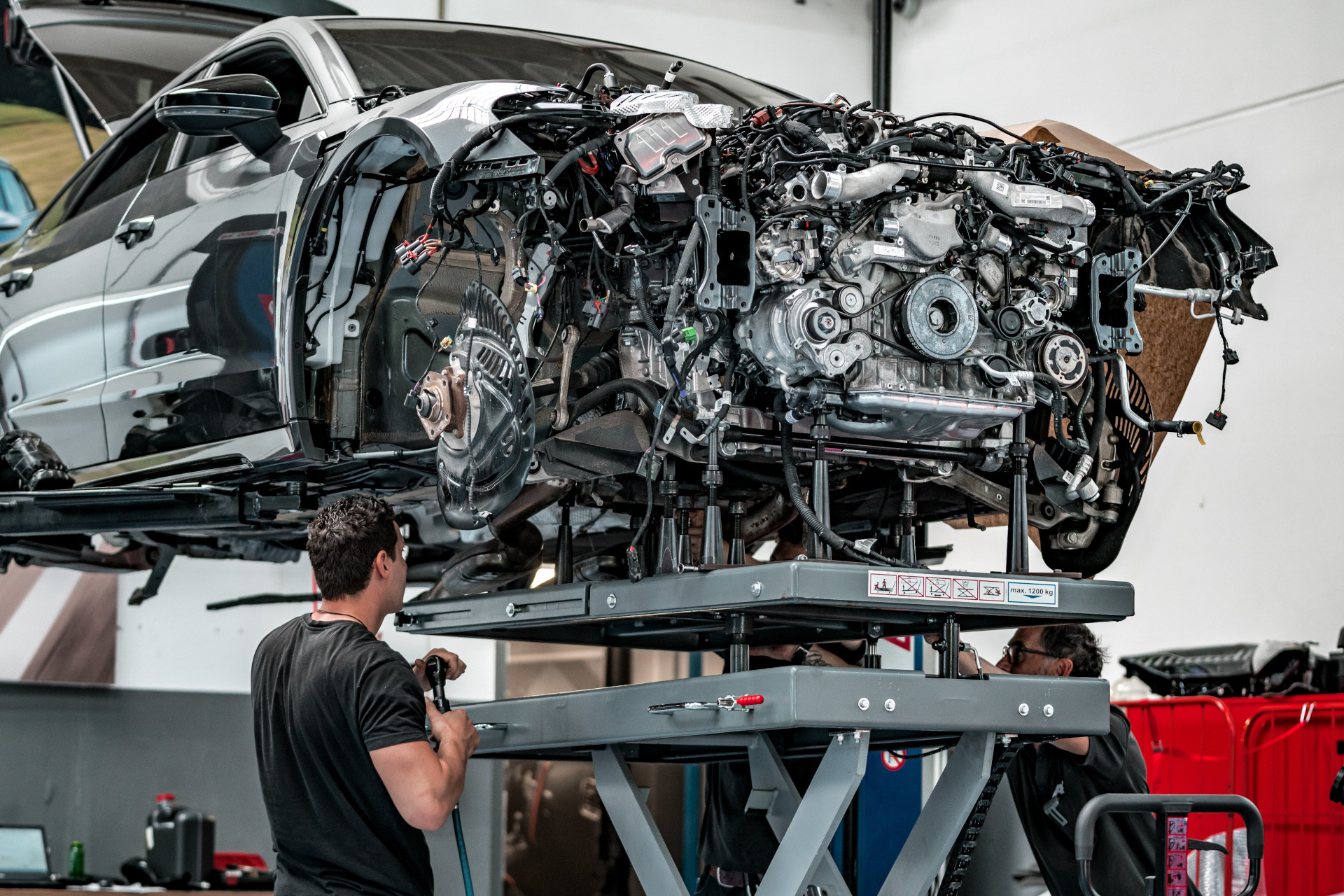 Close-up of engine installation car on lift