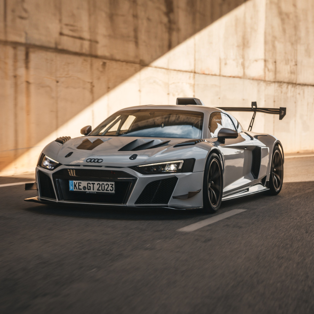 Black and white ABT XGT from the side front view on the road in a tunnel